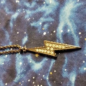 Black metal and rhinestone lightening bolt necklace.